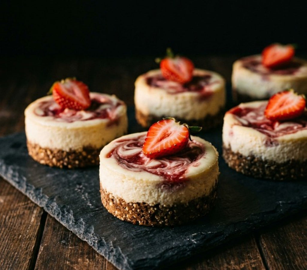 Strawberry swirl mini cheesecakes from The Better Desserts Bible