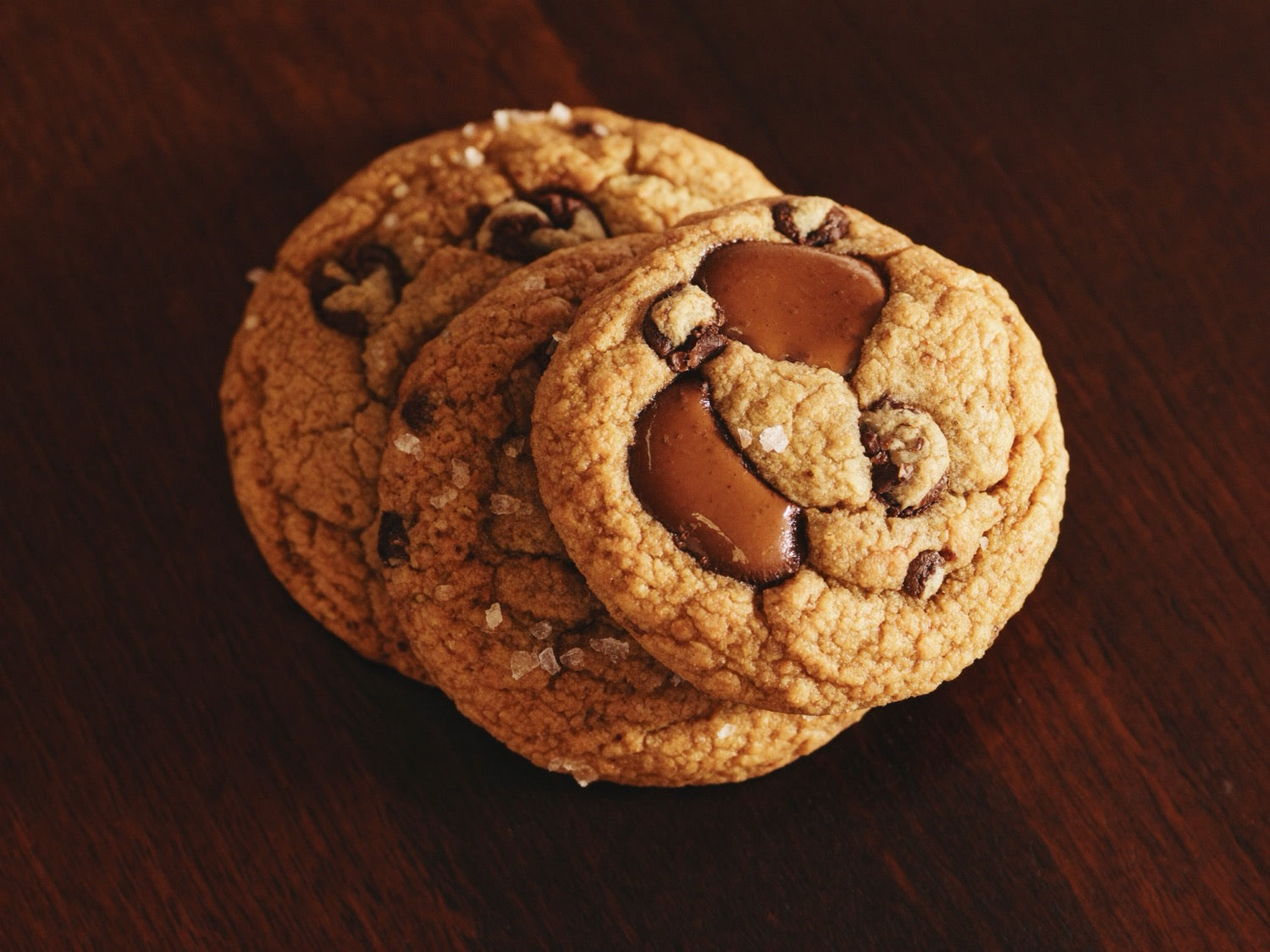 Golden home-baked cookies cooling on a rack